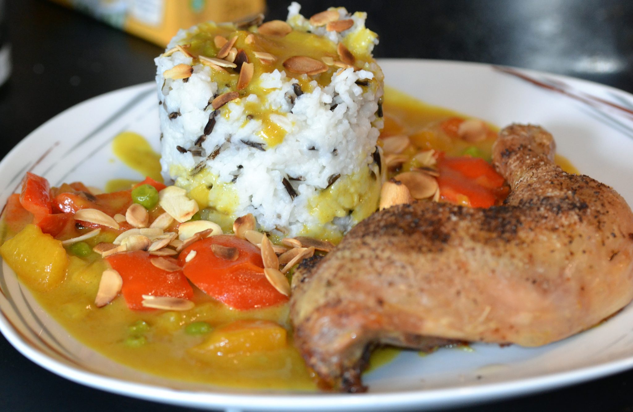 Hähnchenschenkel mit Curry und Reis - Kuechenfeedeluxe